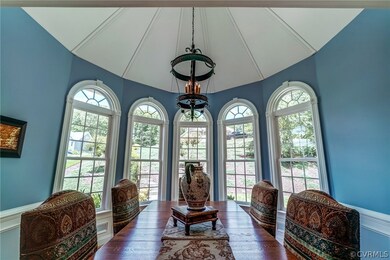 Formal Dining Room features a Stylish Chandelier,