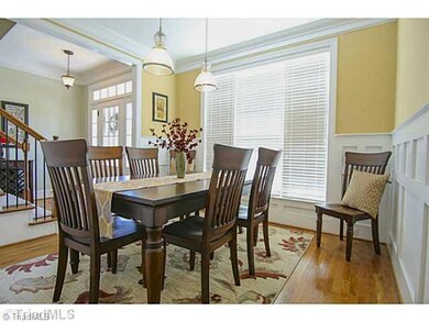 Dining Room. Hardwoods, craftmans style wainscoting, crown molding.  2