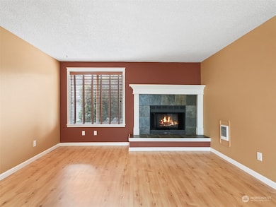Living Room w/ Wood-Burning Fireplace