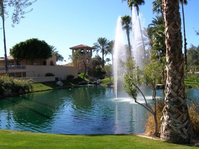 FOUNTAIN/CLB. HOUSE IN BACK GROUND