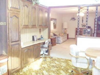 Kitchen view of side cabinets & desk<|>
