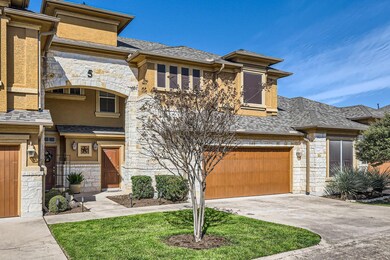 View of front of home featuring a garage, a shing
