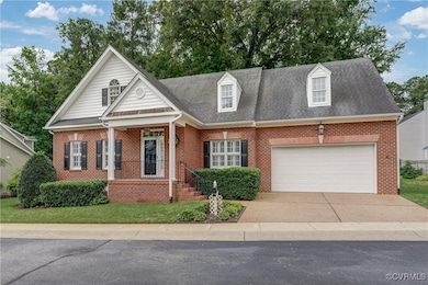 View of front facade with driveway, an attached ga