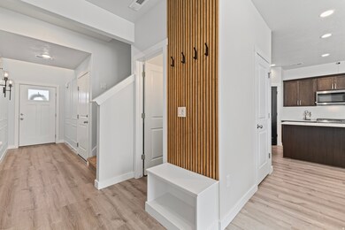 Entryway with recessed lighting and light wood-type flooring