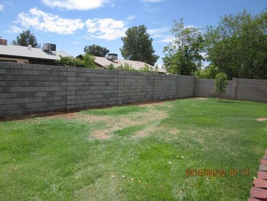 BACK YARD WITH BLOCK FENCING