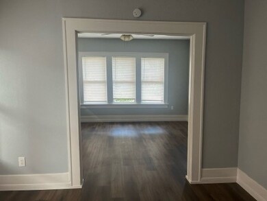 View from formal dining to living room.