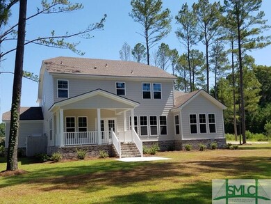 Beautiful view of the rear exterior of the home wi