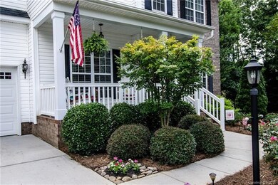 Front porch with beautiful plantings.