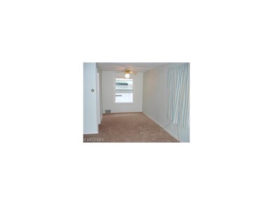 Formal dining room has new carpet and paint with n