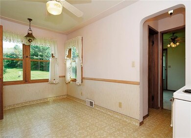 Half bath located in a short hallway between the k