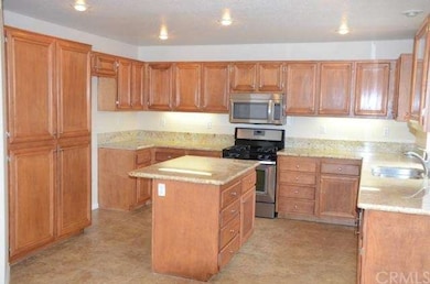 Large chefs kitchen with stainless steel appliance