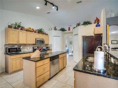 Large kitchen with updated appliances and island.