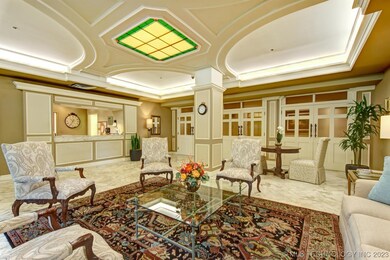 FRONT DESK AND VIEW TO TWO PUBLIC ELEVATORS.  SERV