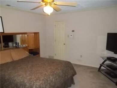 Master bedroom on first floor offers a spacious wa