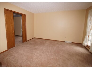 Living room with full length windows to let the na