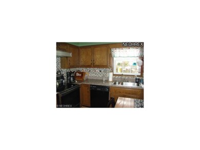 This kitchen has new granite counter tops and tile