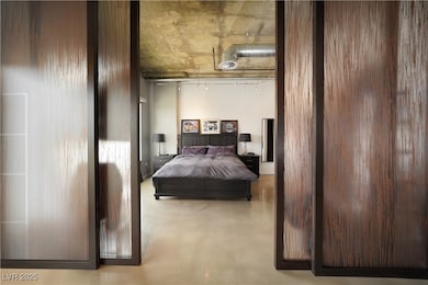 Bedroom with concrete floors