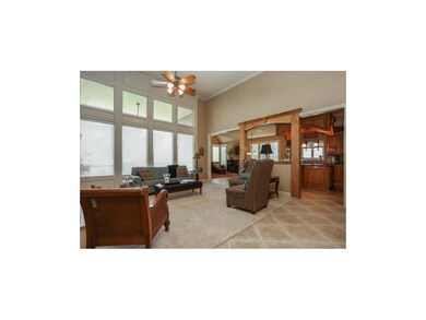 High ceilings and tall windows overlook covered de