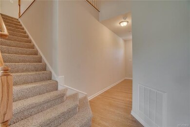 Graceful waterfall stairs w/ dramatic two-story Fo