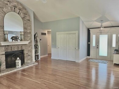 Towering great room with hardwood & attractive woo