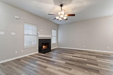 Unfurnished living room with hardwood / wood-style