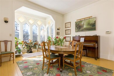 Dining room with light-filled bay...