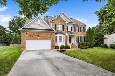 View of front of house featuring a garage and a fr