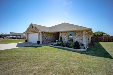 Ranch-style house with a garage and a front yard