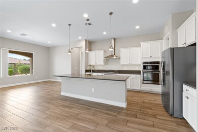 Kitchen with appliances with stainless steel finis