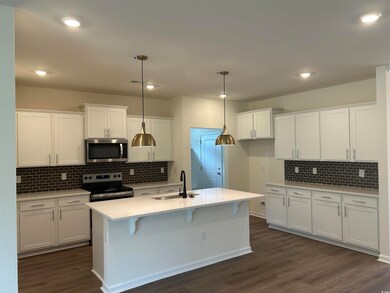 Kitchen with appliances with stainless steel finis