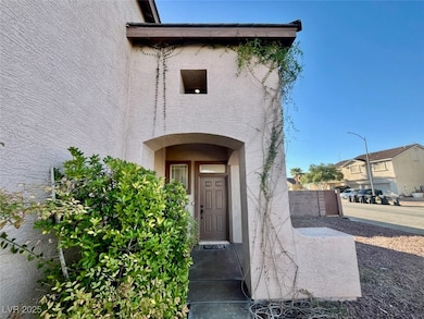 Property entrance with stucco siding