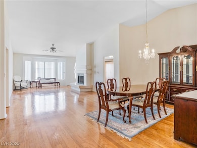 Dining space featuring ceiling fan with notable ch