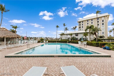 Community pool and patio area facing Moorings Bay