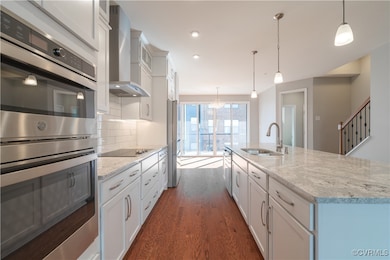 Kitchen featuring stainless steel appliances, hang