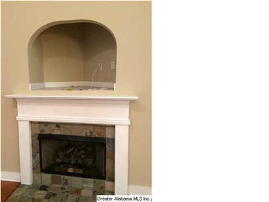 Gas log fireplace with mantle and tile surround,