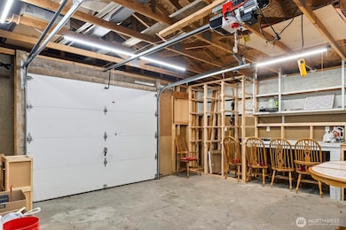 Garage door with electric opener and lift