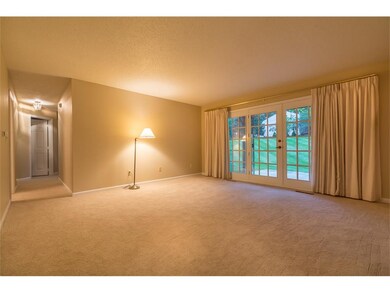 Living room has French doors to patio overlooking 