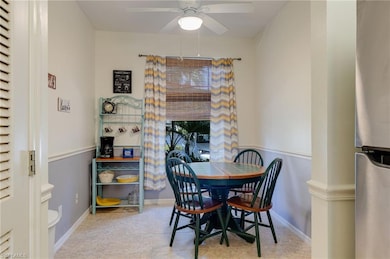 Dining room with ceiling fan and light tile patterned floors