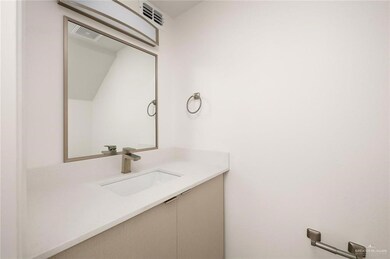 Bathroom with vanity and visible vents