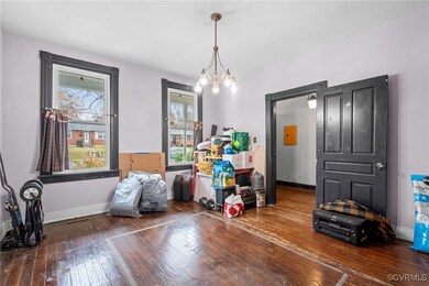 Misc room with dark hardwood / wood-style floors a