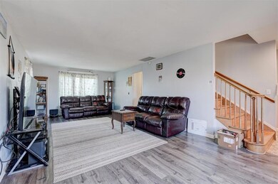 Living room with hardwood / wood-style floors