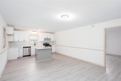 Kitchen featuring stainless steel appliances, unde