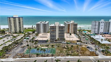 View of apartment building / complex featuring a water view - Virtually Edited Image