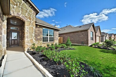 Grand entry when you open that Upgraded gorgeous Mahogany Wood Front Door you will be amazed!  Stunning Home! Covered Front Porch!  Upgraded Stone and Brick Elevation! Lush Landscaped Lot and more!