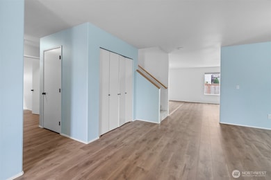 Laminate flooring spans throughout the main level of the home.