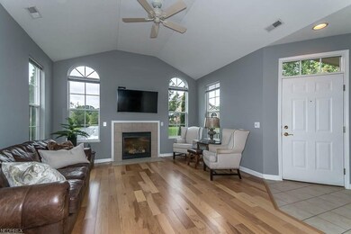 Great Room with new hardwood floor, vaulted ceilin