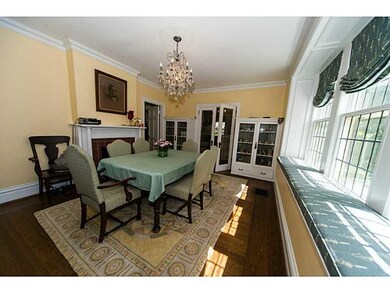 Dining Room. Leaded glass built ins flank the fren