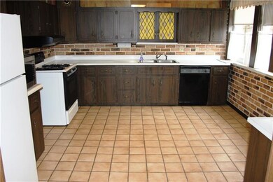 Spacious kitchen with lots of counter and cabinet 