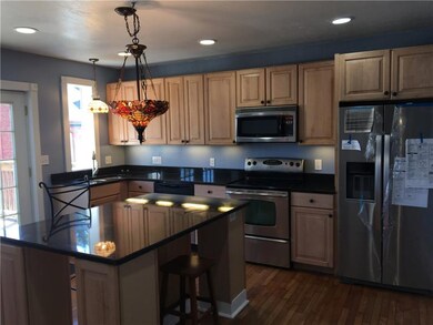 Spectacular 16x15 maple eat in kitchen with granit