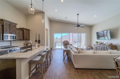 Living area with recessed lighting, high vaulted c